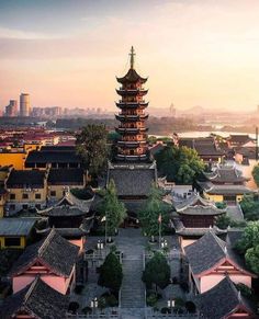 an aerial view of a city with buildings and pagodas