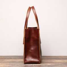 Features Vintage full grain leather L 13" x W 3.9"xH 8.6" About 1.5 Ibs Two carrying handles Multiple accessory and organizer pockets Adjustable/removable shoulder strap Leather Tote Satchel For Office, Large Capacity Leather Top Handle Satchel, Large Capacity Leather Satchel With Top Handle, Leather Shoulder Bag For Business, Large Capacity Leather Top Handle Shoulder Bag, Large Capacity Leather Shoulder Bag With Top Handle, Leather Shoulder Bag With Large Capacity And Top Handle, Leather Handheld Office Bag, Handheld Leather Office Bag