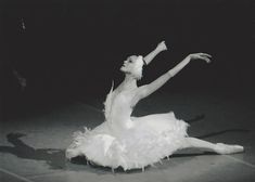 a black and white photo of a ballerina