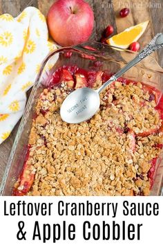 an apple cranberry sauce and apple cobbler in a glass dish with a spoon