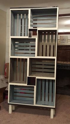 a book shelf with many different colored boxes on it