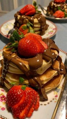 chocolate covered waffles with strawberries on top