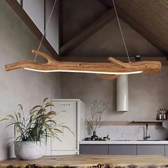 a wooden light hanging over a kitchen counter