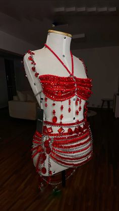 a red and white dress on display in a room