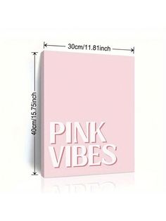 a pink box with the words pink vibes printed on it, next to a ruler