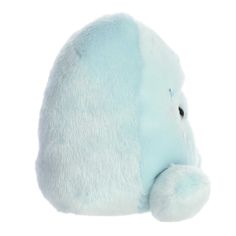 an elephant stuffed animal sitting up against a white background