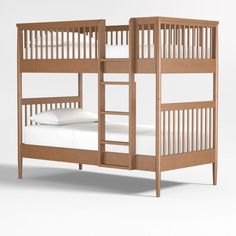 a wooden bunk bed with white sheets and pillows on it's bottom level, against a white background