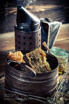 some honeycombs in a metal container on a table