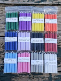 many different colored candles in plastic bags