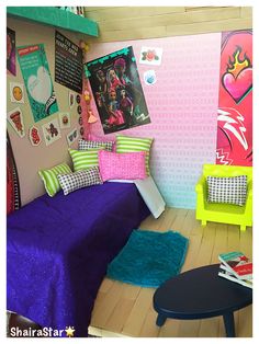 a room with a bed, table and pictures on the wall above it is decorated in bright colors