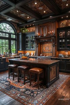 a large kitchen with black cabinets and wooden floors