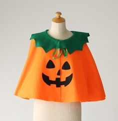 an orange cape with a pumpkin on it