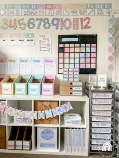 there are many boxes and bins on the shelves in this room, all labeled with numbers