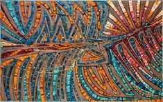 an art piece made out of stained glass and metal strips, with colorful patterns on it