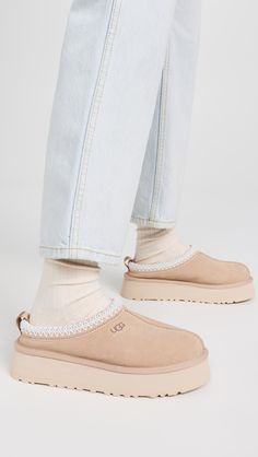 Cannot be shipped outside the USAUpper: Cowhide suedeEmbroidered, padded collarRound toeEVA soleImported, VietnamThis item cannot be gift-boxedStyle #UGGGG30291 Ugg Slippers Platform, Ugg Tazz Slippers, Tazz Slipper, Tazz Slippers, Slippers Platform, Ugg Tazz, Soft Gloves, Van Accessories, Women's Spurs