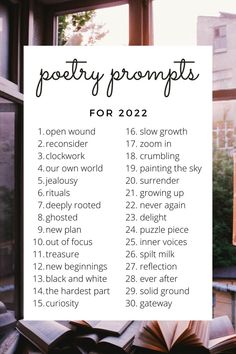 an open book sitting on top of a window sill next to a sign that says poetry prompts