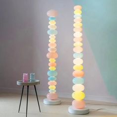 there are two lamps that have different colored circles on them and one is lit up