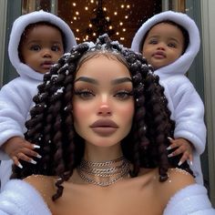 a woman with two small children on her shoulders, both dressed in white and wearing matching outfits