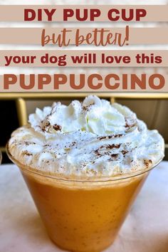 a cup filled with whipped cream on top of a table next to a sign that says diy pup cup but better your dog will love this pup