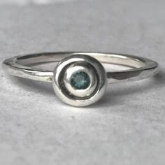 - Handcrafted By An Artist In Toronto, Canada Using Recycled Sterling Silver. - 2.5mm Green Tourmaline With Blue Tones Natural Gemstone Set Into Ring. - Size 9 - Stacks Beautifully With Other Rings - Perfect For Everyday Wear, Just The Right Amount Of Sparkle Making This Ring A Great Gift For Women Or Men. Silver Tourmaline Birthstone Ring Gift, Silver Tourmaline Birthstone Ring, Cool Silver Rings, Stone Settings Jewelry, Thick Silver Ring, Silversmith Rings, Silversmith Jewellery, Green Tourmaline Ring, Unusual Rings