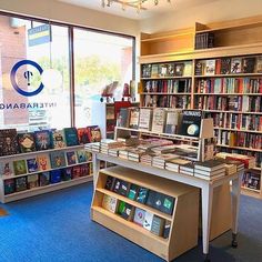 the inside of a book store with many books on display