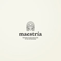 the logo for maestria is shown in black and white, with an arched window behind it