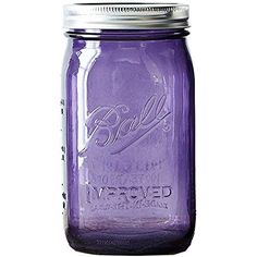 a purple mason jar with a silver lid