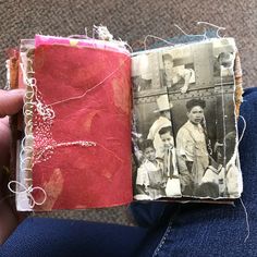 an old photo is being stitched into a book with twine and thread on it