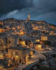 an old town with the words mater written in front of it and lit up at night