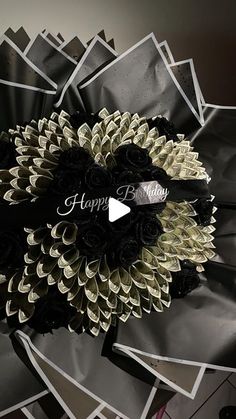 a black and white flower with the words happy birthday on it