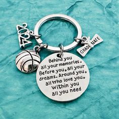 a keychain with a basketball, basketball ball and i love you all you need