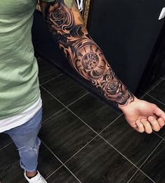 a man with a tattoo on his arm