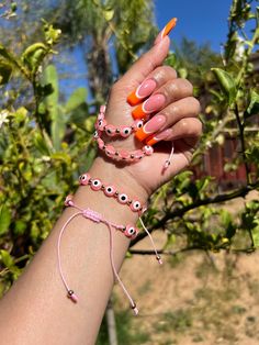 Evil Eye 🧿 Beaded Bracelet In many cultures, it is believed that evil eye bracelets protect against misfortune, evil looks and negative energy. Wear your bracelet for good luck and protection. ✨ Pink Evil eye protects your friendships and exhibits a calming, relaxing feeling. ✨ Cheap Pink Evil Eye Bracelets, Affordable Pink Evil Eye Bracelets, Trendy Evil Eye Friendship Bracelets As Gift, Trendy Evil Eye Friendship Bracelets For Gifts, Trendy Evil Eye Bracelet For Friendship, Pink Adjustable Evil Eye Bracelet Trendy, Adjustable Pink Evil Eye Trendy Bracelet, Handmade Trendy Evil Eye Bracelet, Evil Eye Jewelry Bracelet