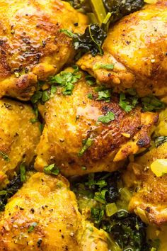 close up view of chicken and vegetables in a skillet with parsley on top