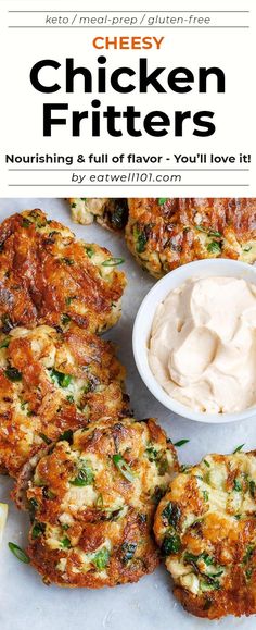 chicken fritters on a plate with a bowl of sauce