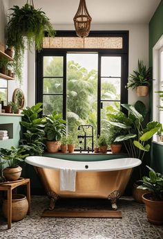 a bathroom with green walls and plants on the windowsill, an antique claw foot bathtub is surrounded by potted plants