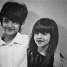 two young children posing for a black and white photo