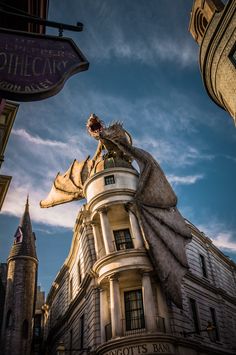 a dragon statue on top of a building