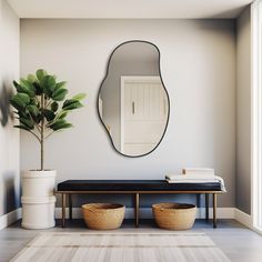 a large mirror hanging on the wall above a bench next to a potted plant