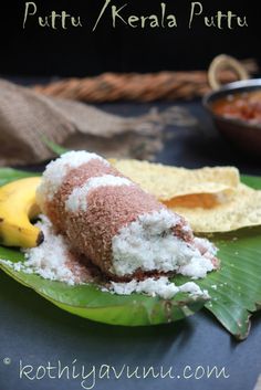 some food is sitting on a banana leaf with powdered sugar and other foods in the background