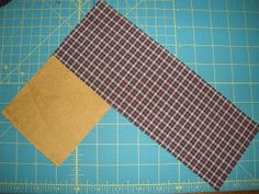 two pieces of fabric sitting on top of a cutting board