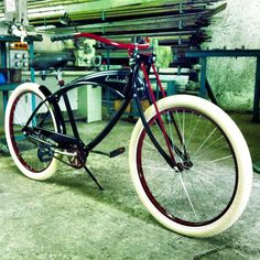 a black and red bicycle parked in a garage