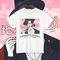 Bring your favorite anime character to life with this exclusive Tuxedo Mask T-shirt, designed for Sailor Moon fans and anime lovers alike. This hand-drawn Tuxedo Mask design captures the essence of the iconic hero from the beloved 90s anime series, perfect for casual wear, anime conventions, or cosplay events. Made from 100% premium cotton, this graphic tee ensures both comfort and durability. The vintage-style illustration makes this shirt stand out among other anime merchandise, offering a tru Anime Events, Custom Tuxedo, Sailor Moon Anime, Tuxedo Mask, Anime Merchandise, 90s Anime, Anime Shirt, Iconic Characters, Mask Design