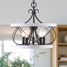 Blend the farmhouse and modern elegance with this drum chandelier. A premium solid wood frame with a metal finish that goes perfectly with your home decor. 5 light bulbs (not included) and 5 metal candle sockets to illuminate your space 360 degrees. The adjustable height chain is compatible with ceilings of various heights. The unique drum structure and weathered wood are a perfect 5-light kitchen lighting to give your chandelier a more retro elegance. You can install modern log cottage lighting Drum Light Fixture, Log Cottage, Drum Ceiling Light, Chandelier Store, Cottage Lighting, Drum Light, Foyer Entryway, Wood Chandelier, Light Kitchen