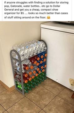 a rack filled with empty water bottles next to a refrigerator