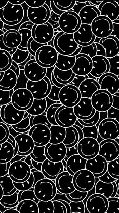 a black and white pattern with smiley faces