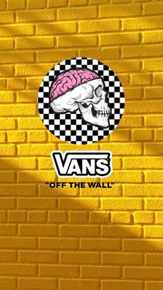 a yellow brick wall with the words vans on it