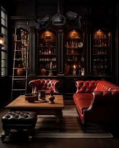 a living room with two red leather couches