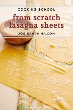 a wooden spoon sitting on top of a table next to pasta and sauces with the words cooking school from scratch lasagna sheets