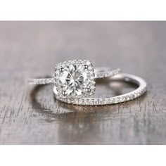 a diamond ring on top of a wooden table